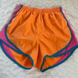 Nike orange and pink shorts, size small